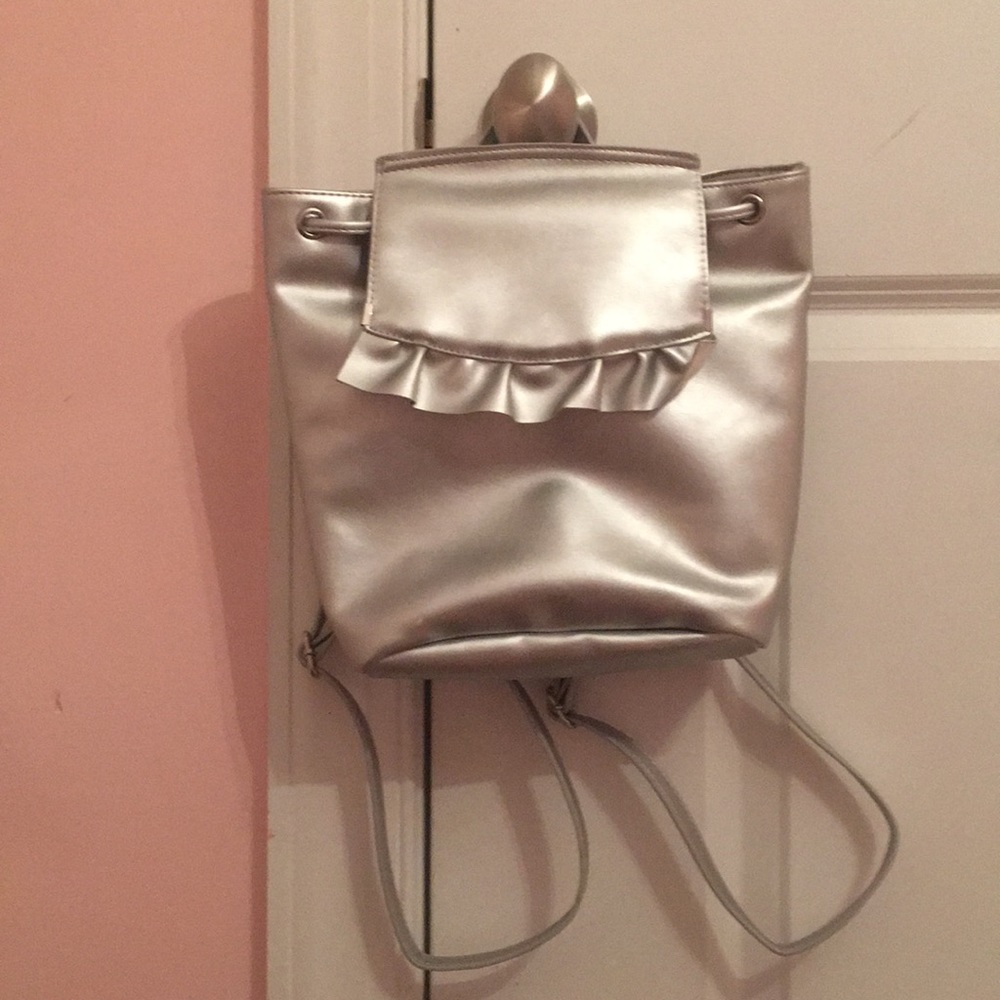 NWOT mini backpack silver